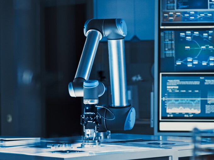 A robotic arm performing precise tasks in a high-tech lab setting.
