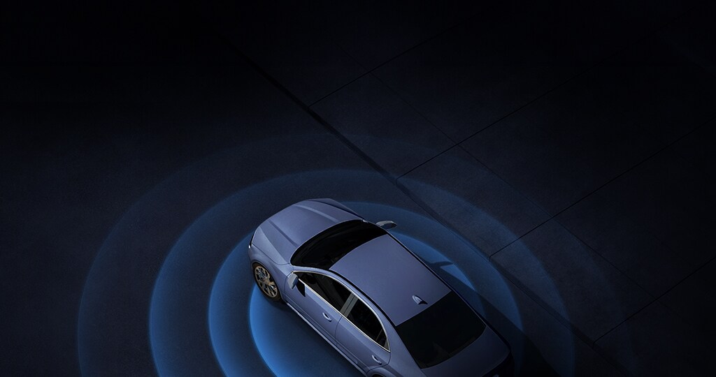 A modern car surrounded by blue radar waves, illustrating advanced connectivity.